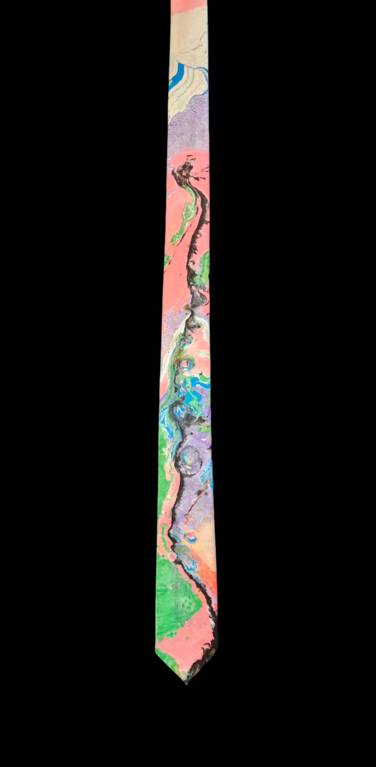 A tie with a marbled pattern featuring various colors including red, blue, green, and beige.