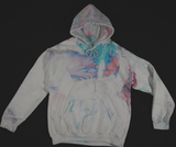 A white hoodie, featuring a marbled multicolor dip dye.
